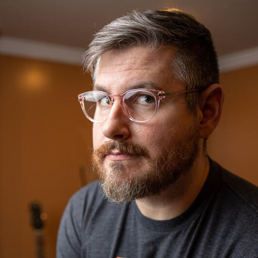 Peter with a dinosaur on his shoulder